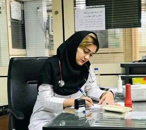 A female doctor with a patient at Rawat Medical Center