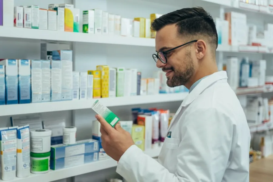 Pharmacist checking a medicine box at the in-house pharmacy
